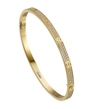 Запирающийся на ключ браслет Love из желтого золота с бриллиантами Cartier.