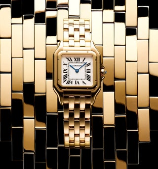 Часы Panthere de Cartier из розового золота с заводной головкой с синим сапфиром.