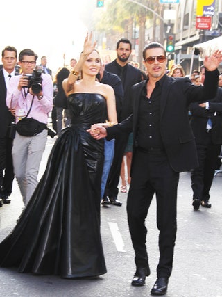Анджелина Джоли в Versace и Брэд Питт в Gucci.