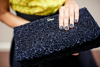 Клатч Dior в руках Равшаны Курковой.