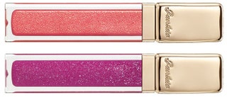 Два оттенка блеска Kiss Kiss Gloss — коралловый и розовый.