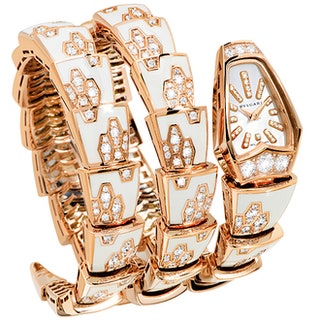 Часы Serpenti от Bulgari из розового золота украшенные бриллиантами и белой эмалью.