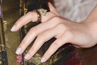 Кольцо Cartier из жклтого золота с бриллиантами изумрудами и ониксами.