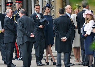Дэвид и Виктория Бекхэм в платье Victoria Beckham.